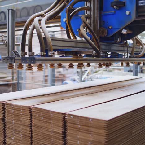 automated wood processing and stacking in a factory
