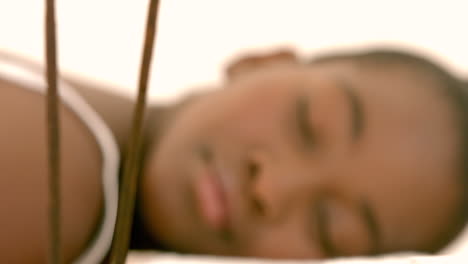 smiling woman lying on massage table