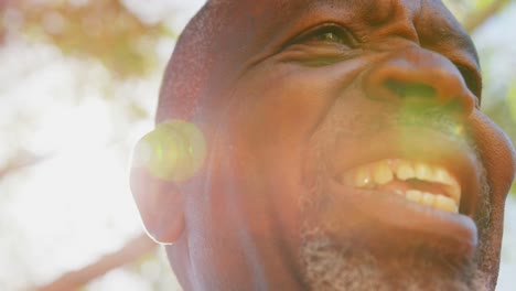 close-up of active african american senior man performing yoga in the garden of nursing home 4k