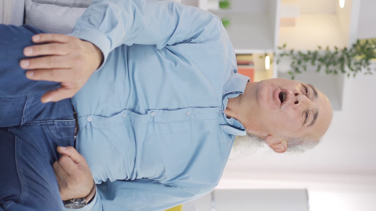 Vertical video of Happy deep breathing old man.