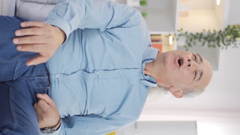 Vertical-video-of-Happy-deep-breathing-old-man.