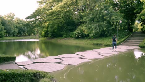 follow up the scene of new normal young asian women are exercising with outdoor running in the park