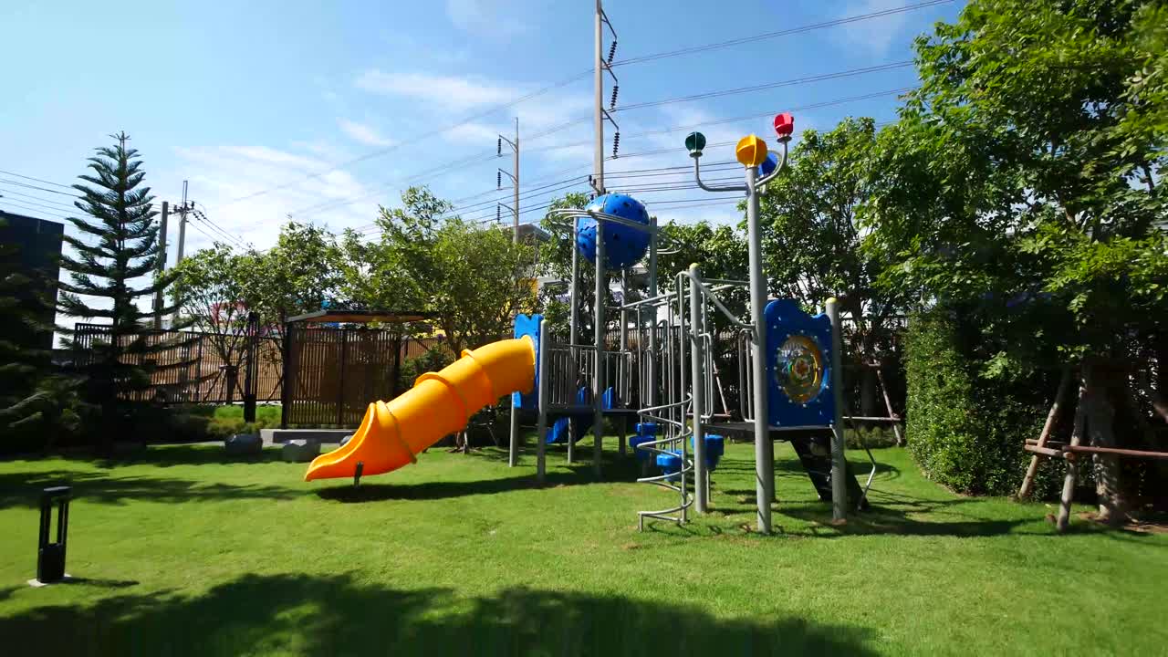 Colorful Children Playground In The Garden On Sunny Day