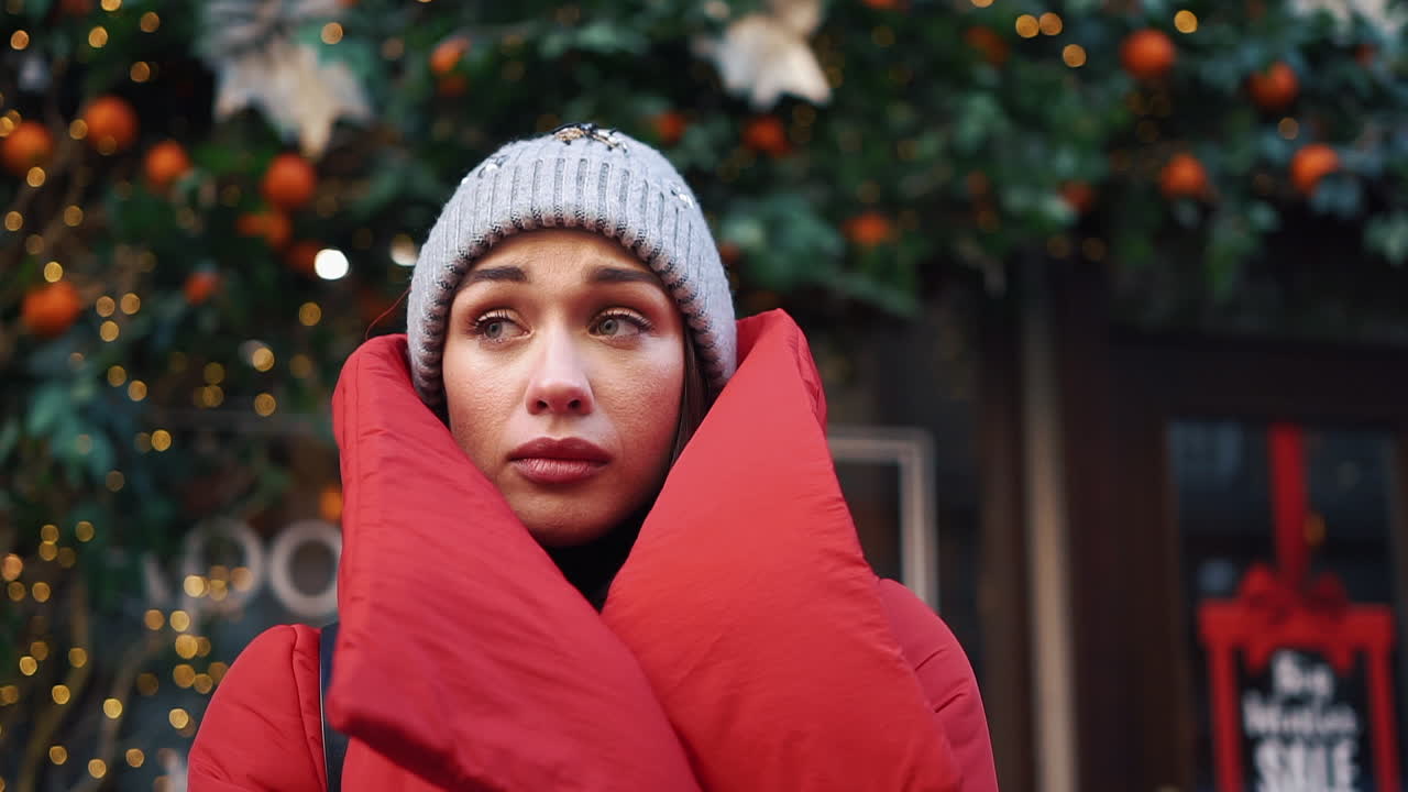 Woman wearing red coat outdoors in winter