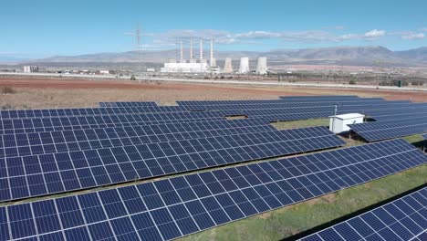 Drone-photovoltaic-solar-panel-park-Coal-fired-power-station-background-sunny