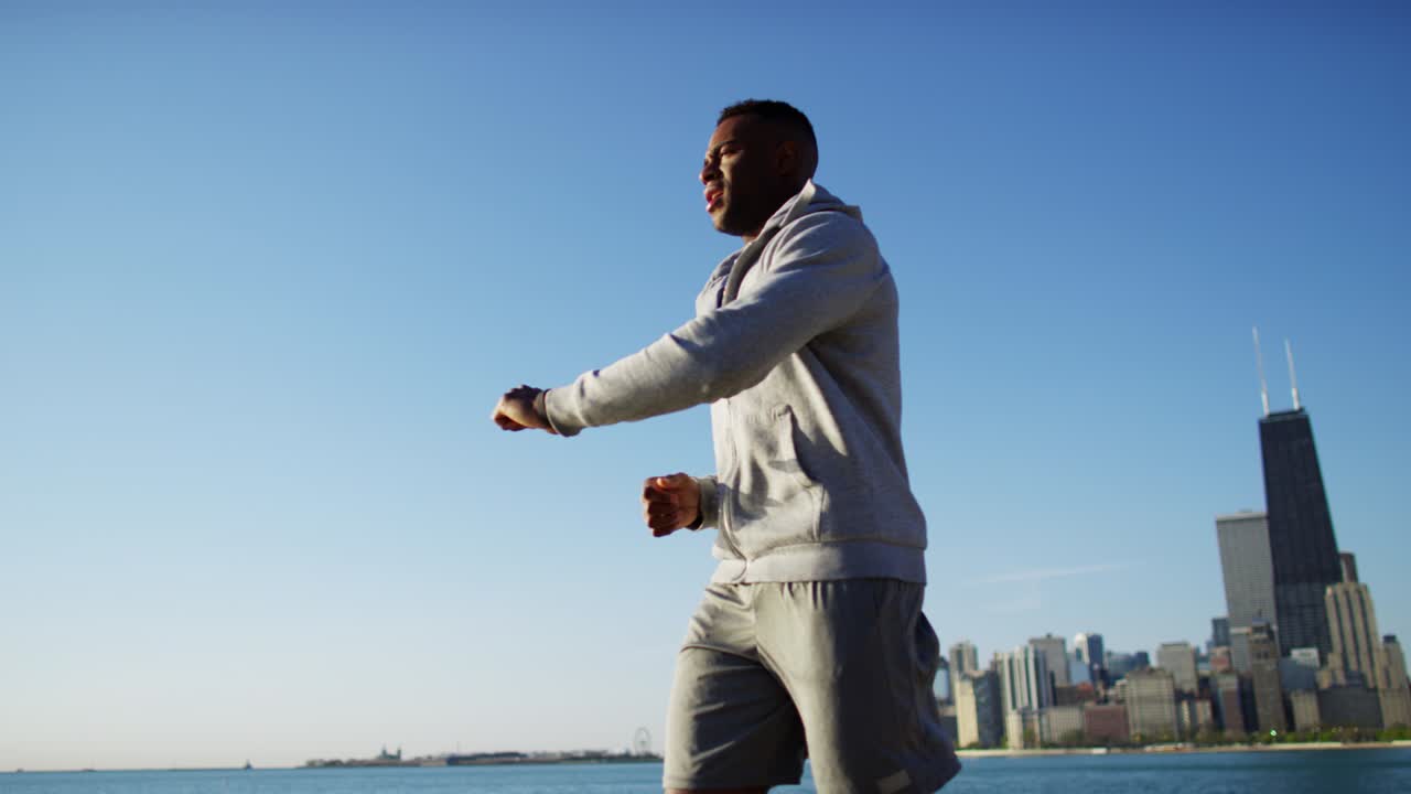 African American male doing running and stretching workout