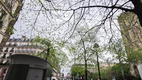 a slow panoramic capture of a bustling paris street.