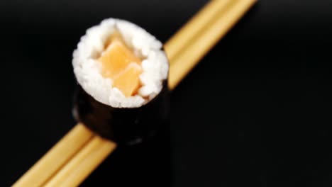 sushi on chopsticks