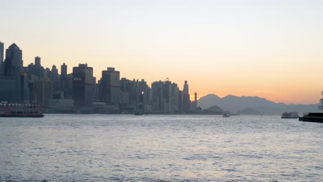 city skyline, silhouettes of tall buildings, water ripple, ferry vessel