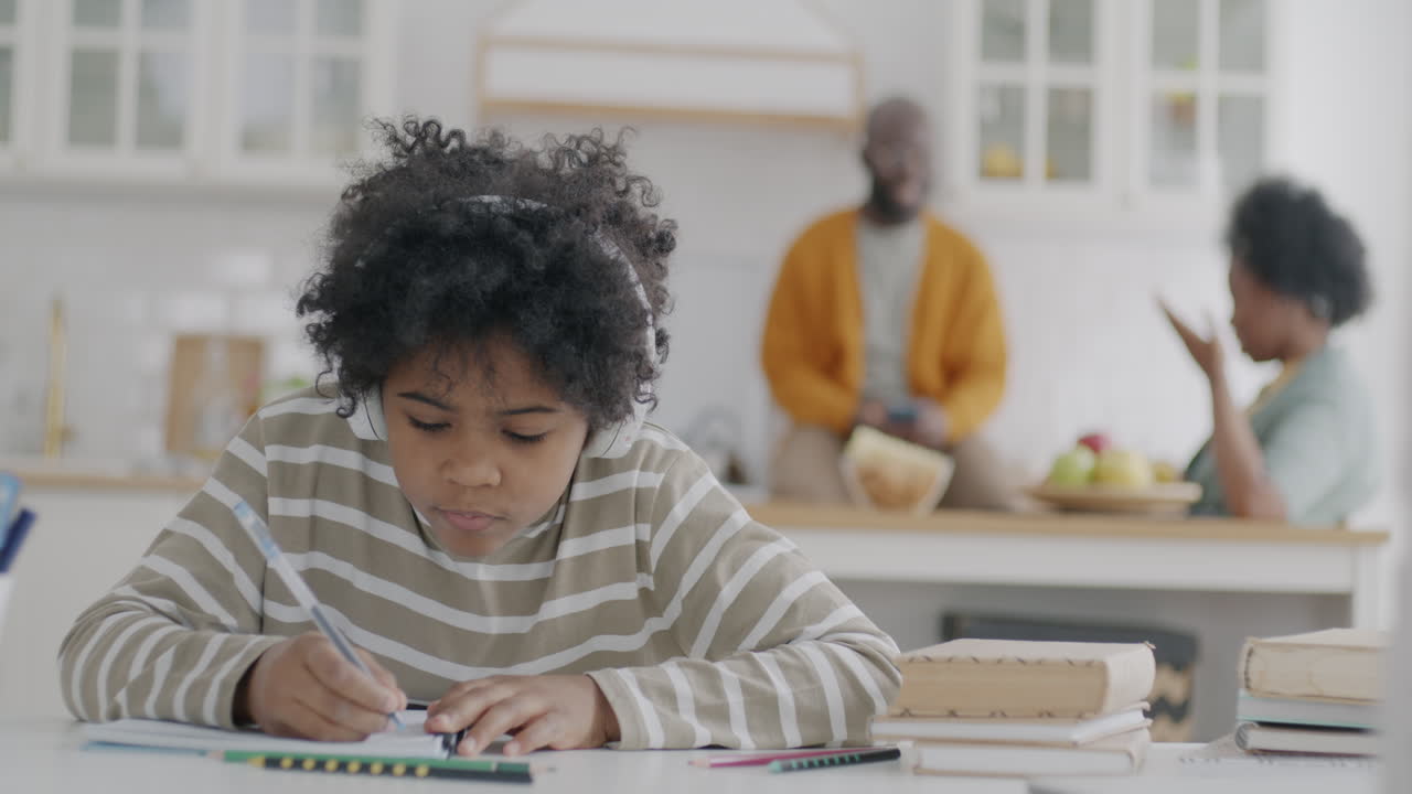 Child Studying at Home with Headphones on