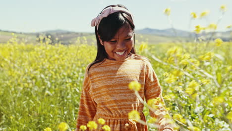 Child,-walking-and-outdoor-in-field-with-flowers