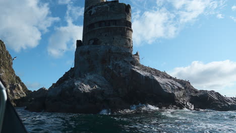 abandoned lighthouse on rocky coastline