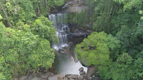 landing near waterfall in jungle forest