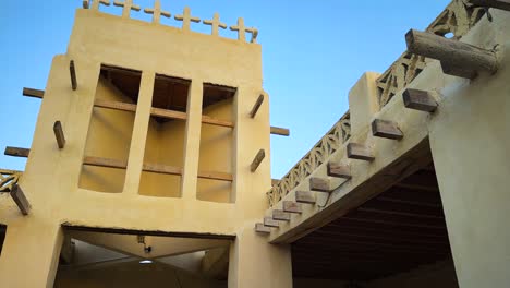 b roll wide view of traditional old house in arabian culture windcatcher ventilation architectural passive design rural village countryside in iran local people life seaside beach coastal town summer