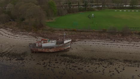 Aerial-ascending-shot-of-the-Corpach-Shipwreck-landmark-in-Fort-William,-Scotland