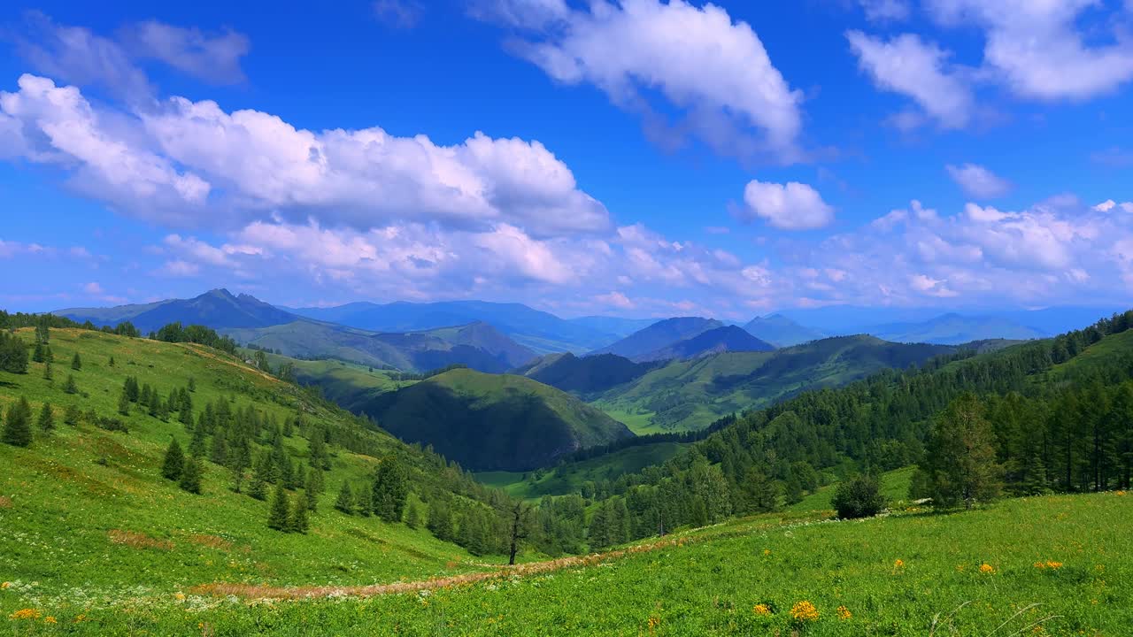 Breathtaking Panoramic Landscape with Lush Green Hills and Expansive Blue Sky Showcasing Majestic Mountains under a Vibrant Cloudscape