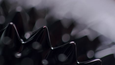 black viscous liquid forming abstract spikes