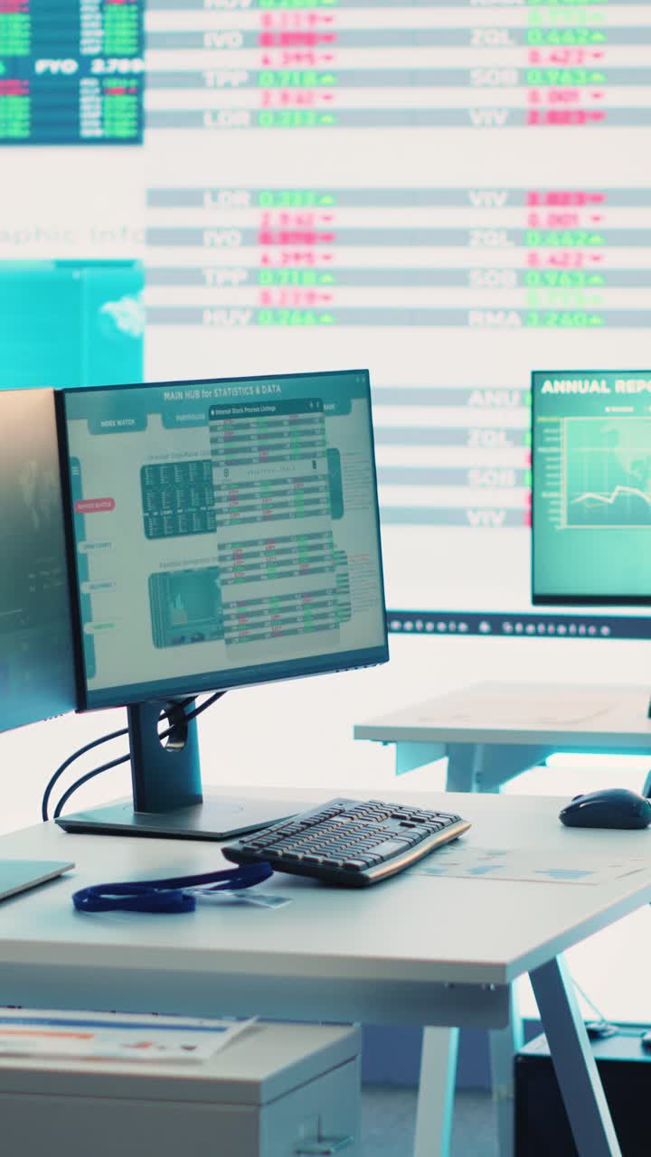 Empty Office Desk with Computer Displaying Financial Data