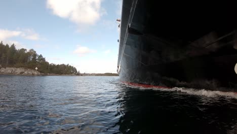 closeup of sea and below ships hull when underway at sea - electric passenger and car ferry hjellestad - slow motion