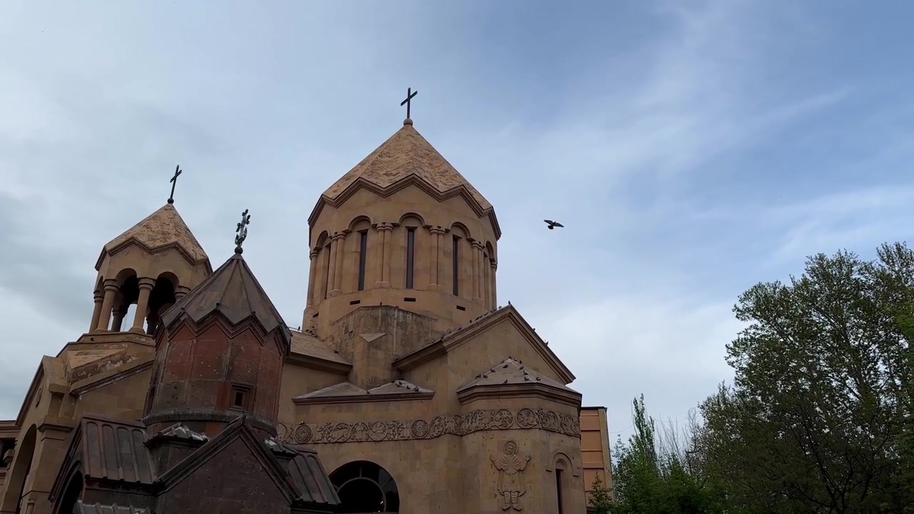 old ancient European Caucasus church chapel cathedral monastery with architecture courtyard arches and pavilion volcanic stone tufa with masonry cross dome facade historic medieval heritage peaceful