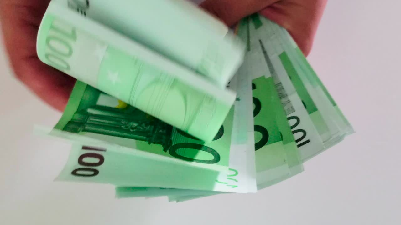 close up view of man hand counting euro money bills - european currency, money, funds.