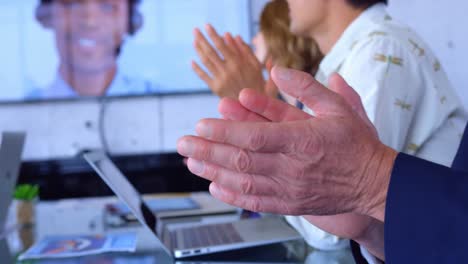 Multi-ethnic-business-people-clapping-in-the-conference-room-at-modern-office-4k