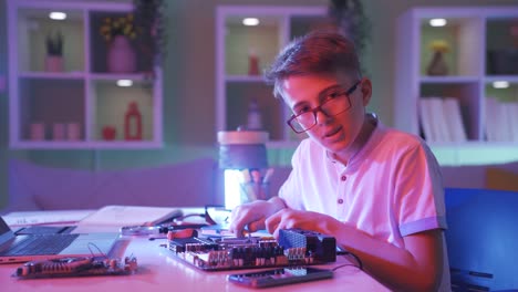 Tech-savvy-boy-makes-positive-gesture-at-camera.