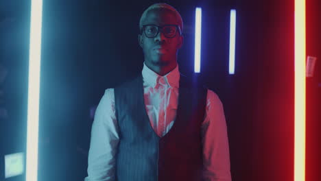 confident business man in neon light with money rain