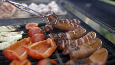 meat is being flipped on a grill