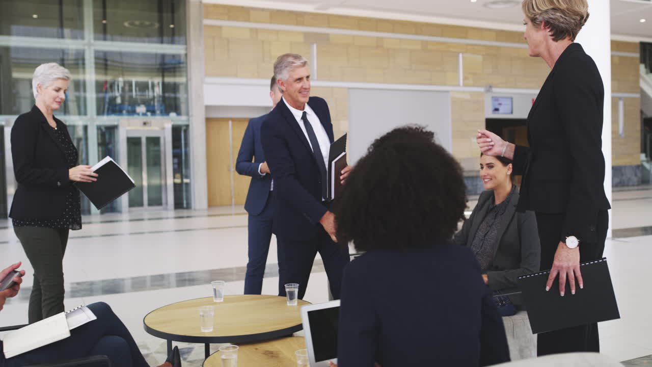 Teamwork handshake of corporate people in a modern