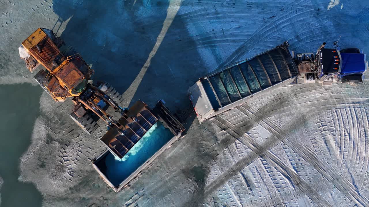 Aerial View of Loader Filling Truck with Blue Road Salt at Detroit Salt Depot