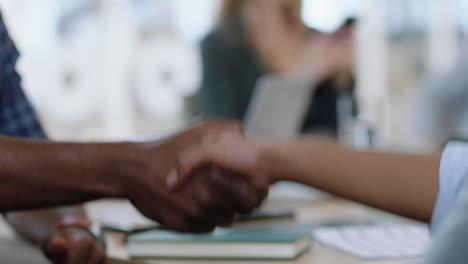 close up handshake successful job interview african american businessman shaking hands with intern in meeting congratulations for new career opportunity in corporate office