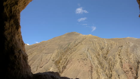 a view from chhoser cave towards dry hill landscape in upper mustang nepal