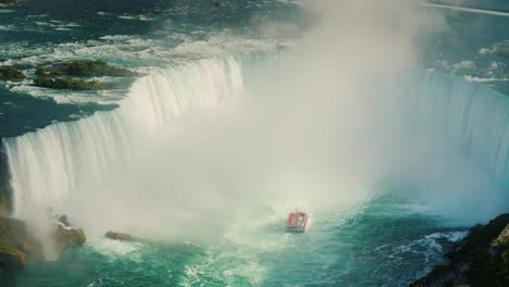 Red-Boat-Under-Blue-Waterfall