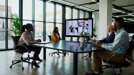 modern office setting with video conference and remote collaboration