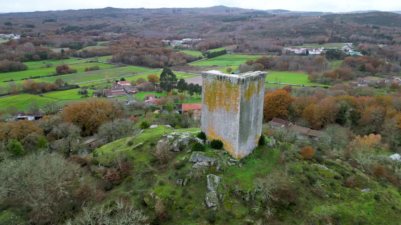 Sandi&aacute;s tower of ourense, spain, aerial orbit around hillside and farmland