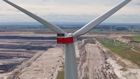 a solitary wind turbine overseeing the garzweiler opencast mine