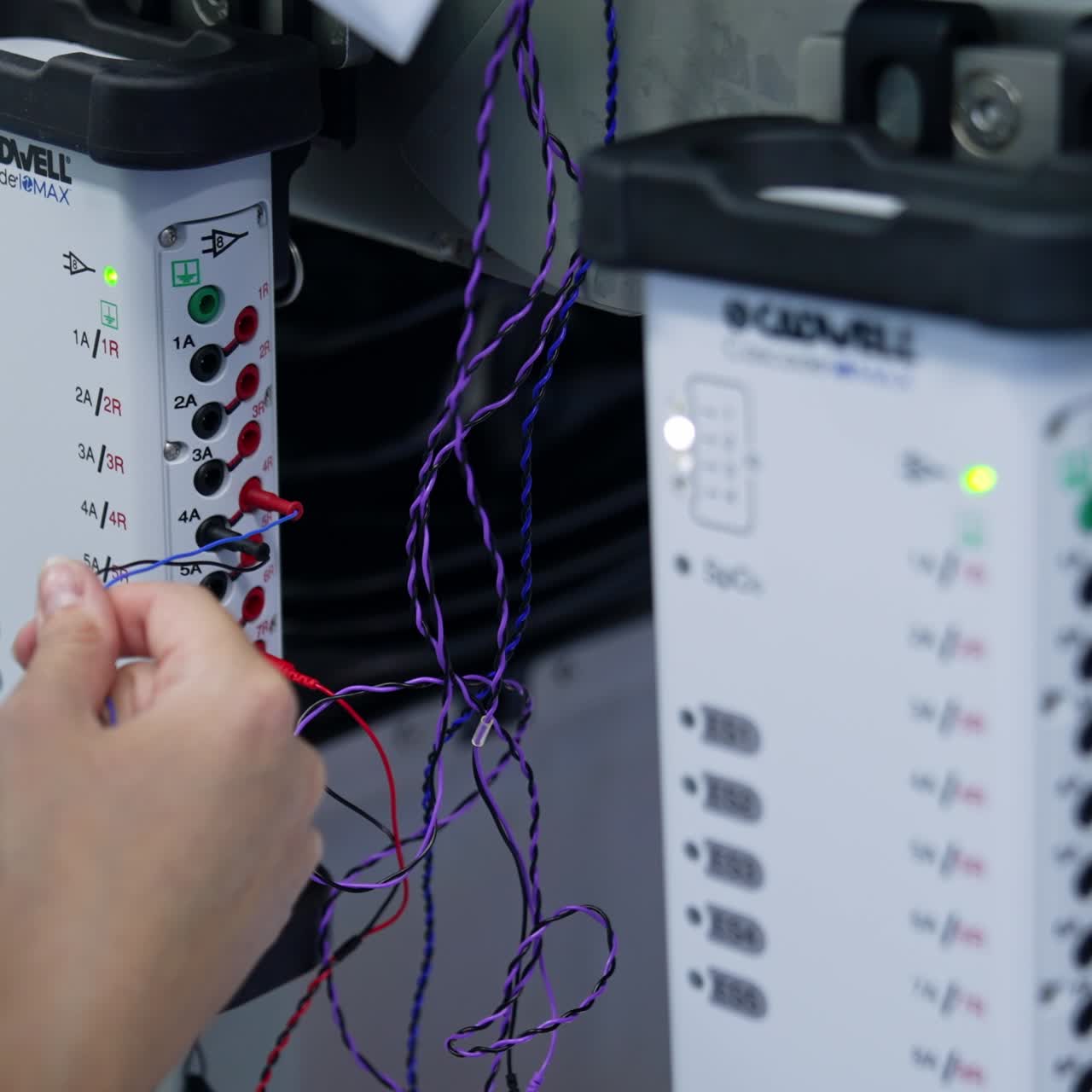 Medic inputs electrodes into the modules of equipment. Close up. Surgical software for EMG