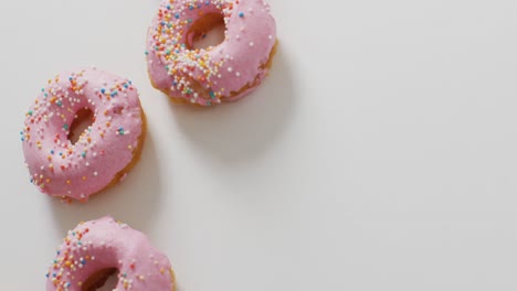 Video-of-donuts-with-icing-on-white-background