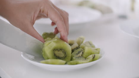 cutting kiwi for healthy breakfast or snack