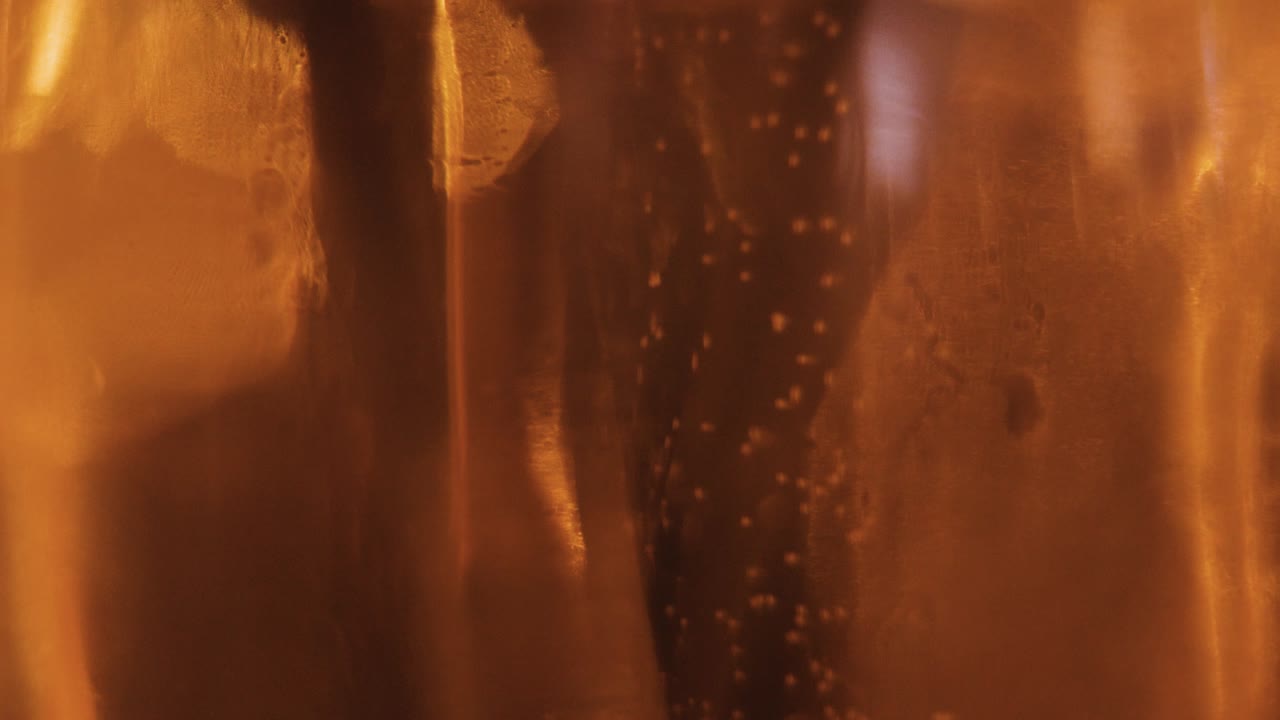 beer bubbles dancing in the glass (slow motion)