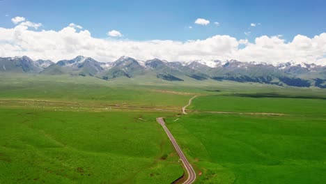 mountains and grassland in a sunny day.