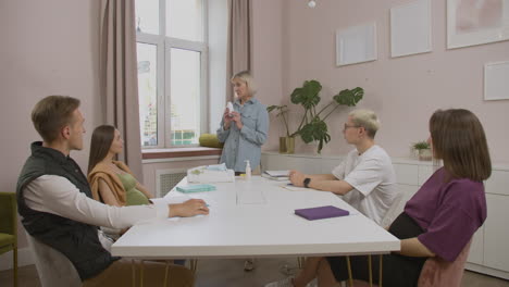 teacher showing products for the baby in class