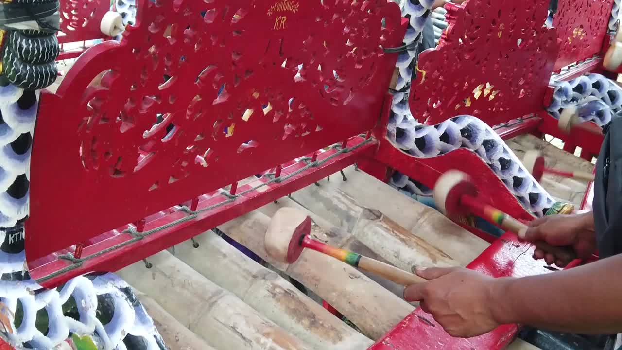 Asian Percussion Music Instruments Played, Gamelan Jegog Bamboo from Bali Indonesia Musician Hitting Sticks with Colorful Mallets