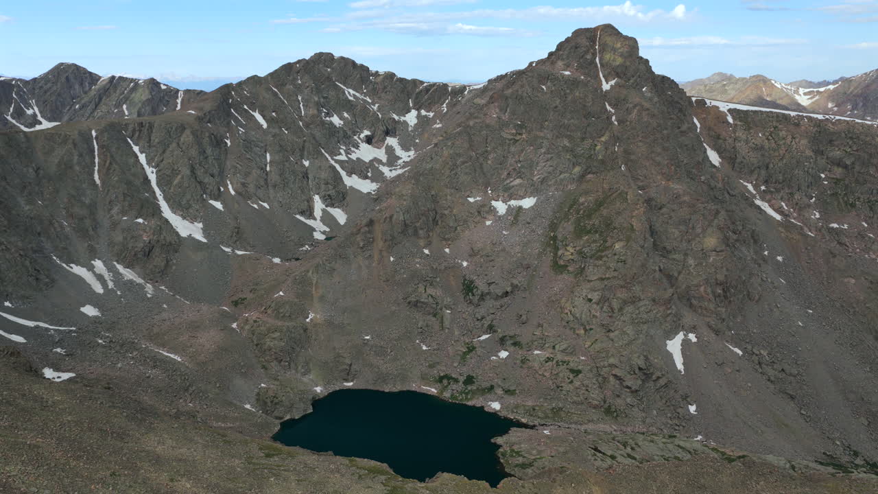 Mount of the Holy Cross 14er prominent peak wilderness landscape view aerial drone Colorado morning clouds North Mountain Shelter Halo Ridge Bowl Of Tears Alpine Lake Rocky Mountains forward pan up
