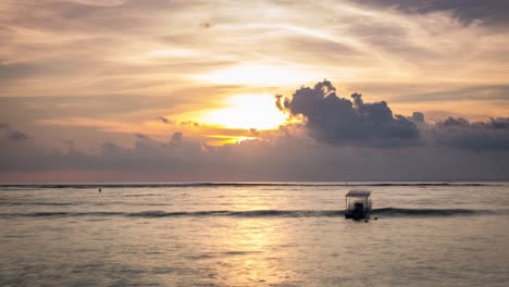 timelapse of sunset  with fishing boat from lembongan island, bali, indonesia
