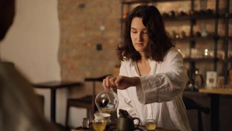 woman enjoying tea time in a cozy cafe