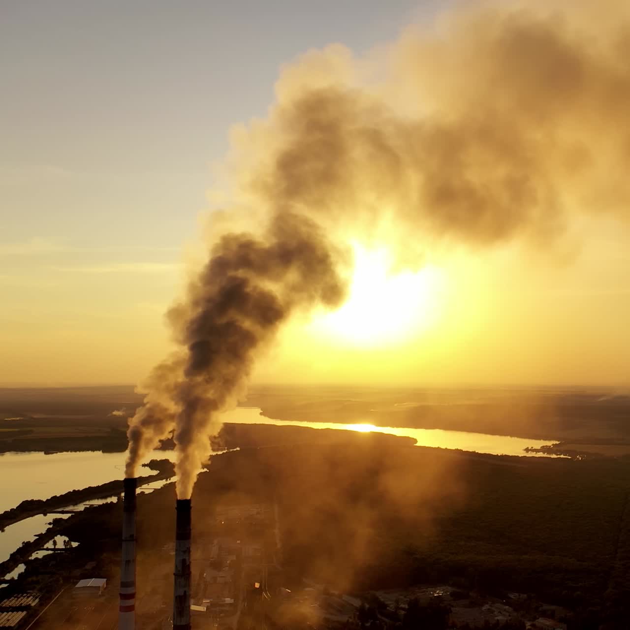 Thick smoke of factory chimneys