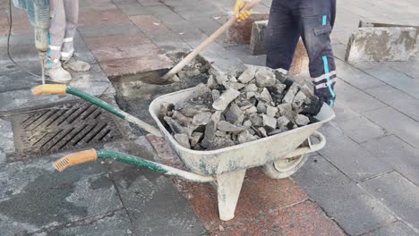 construction workers repairing a sidewalk