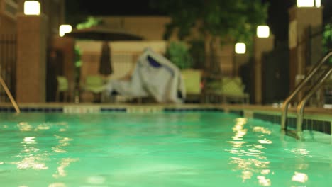 View-of-an-indoor-swimming-pool,-water-is-moving-in-relaxed-and-peaceful-indoor-ambient